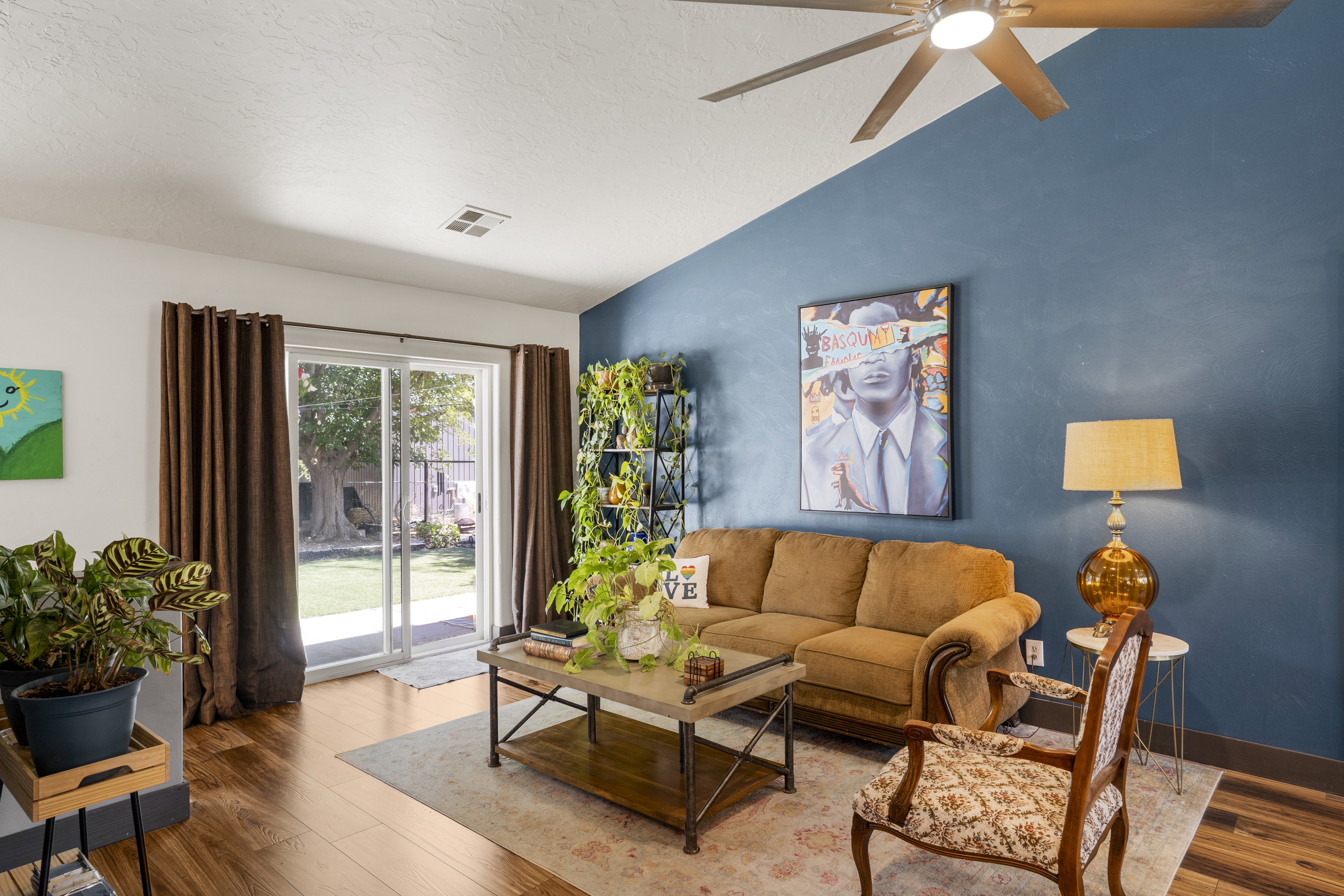 Living room featuring wood finished floors and ceiling fan