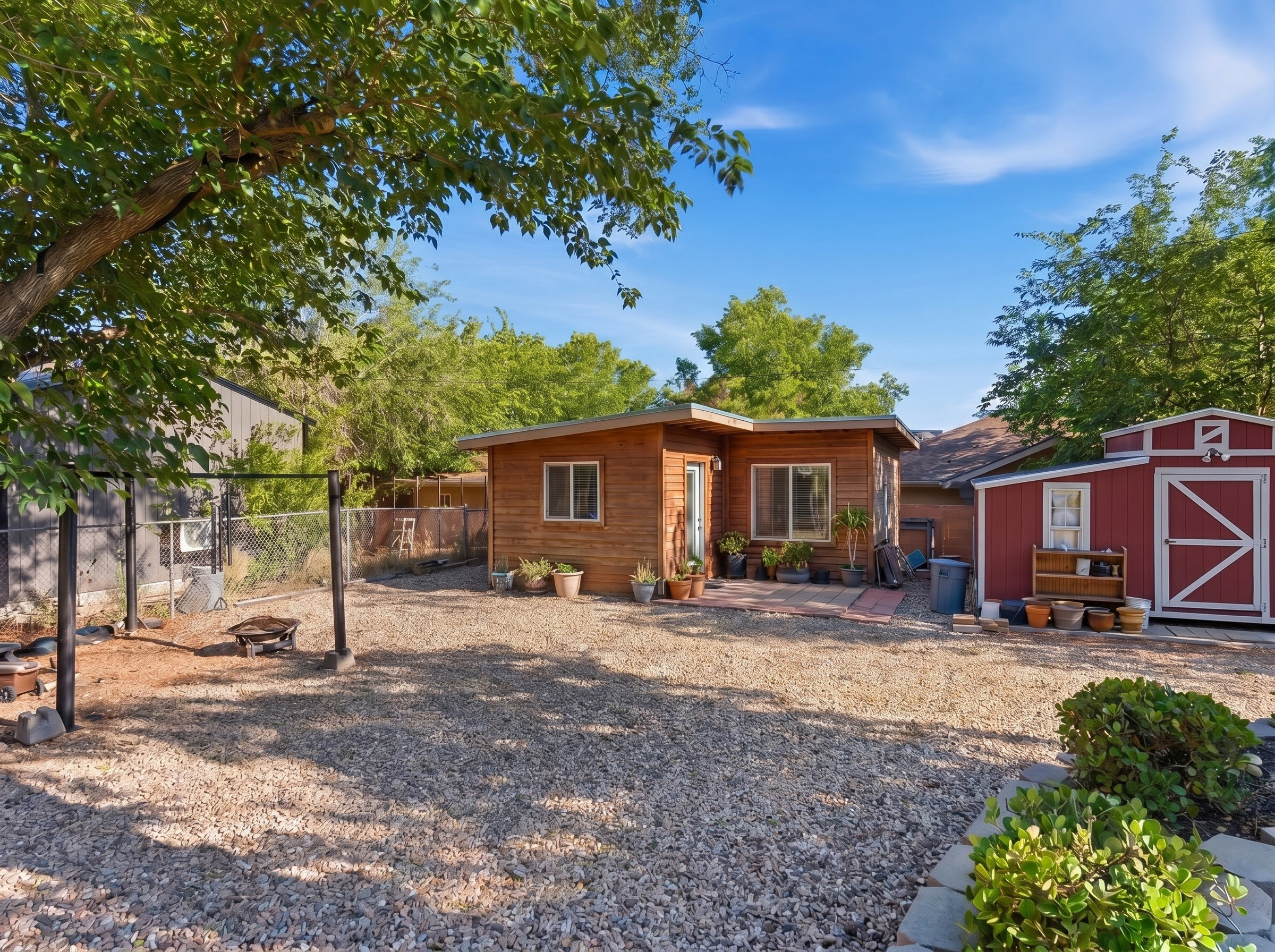 Back of property featuring a storage shed