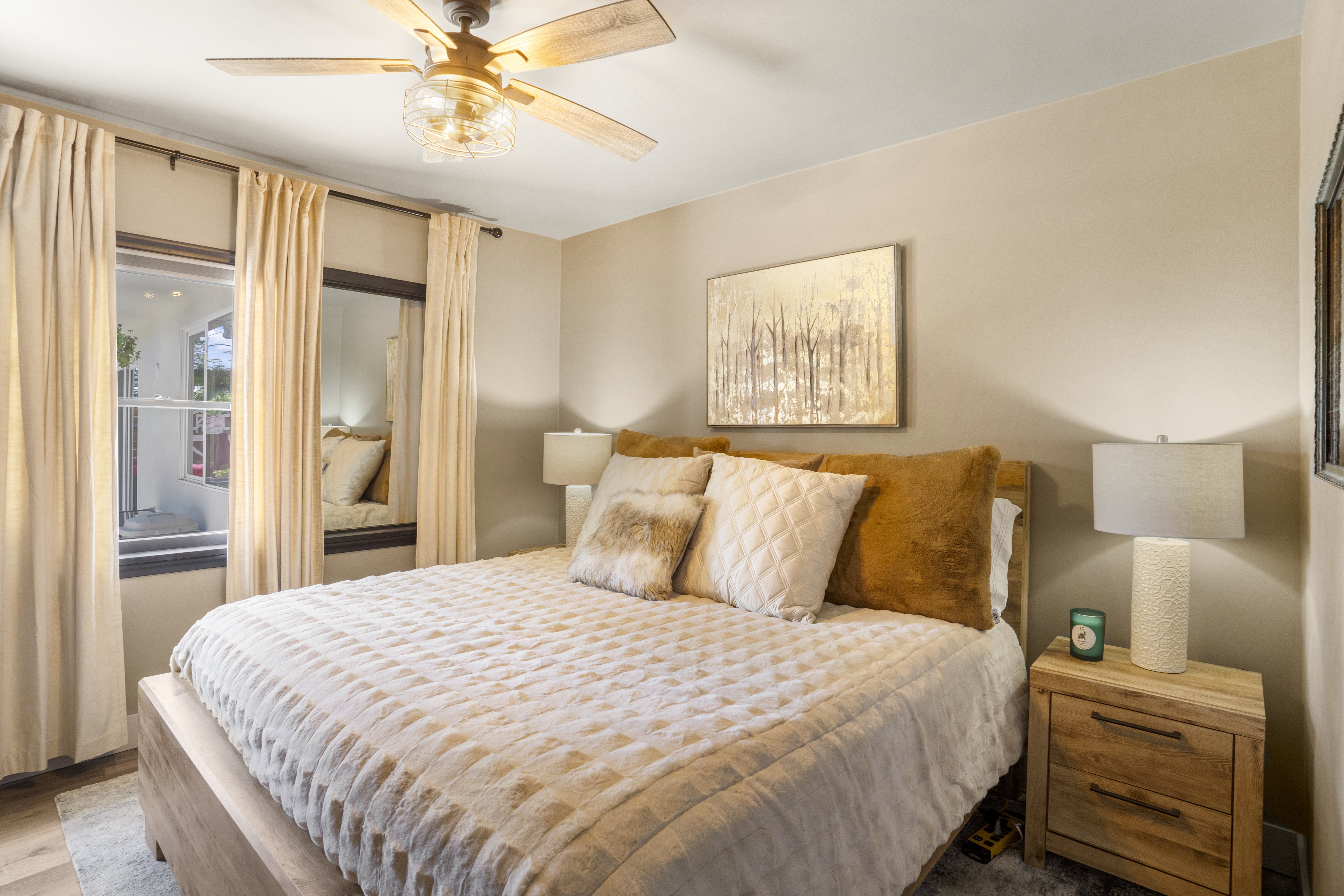 Bedroom with ceiling fan and wood finished floors