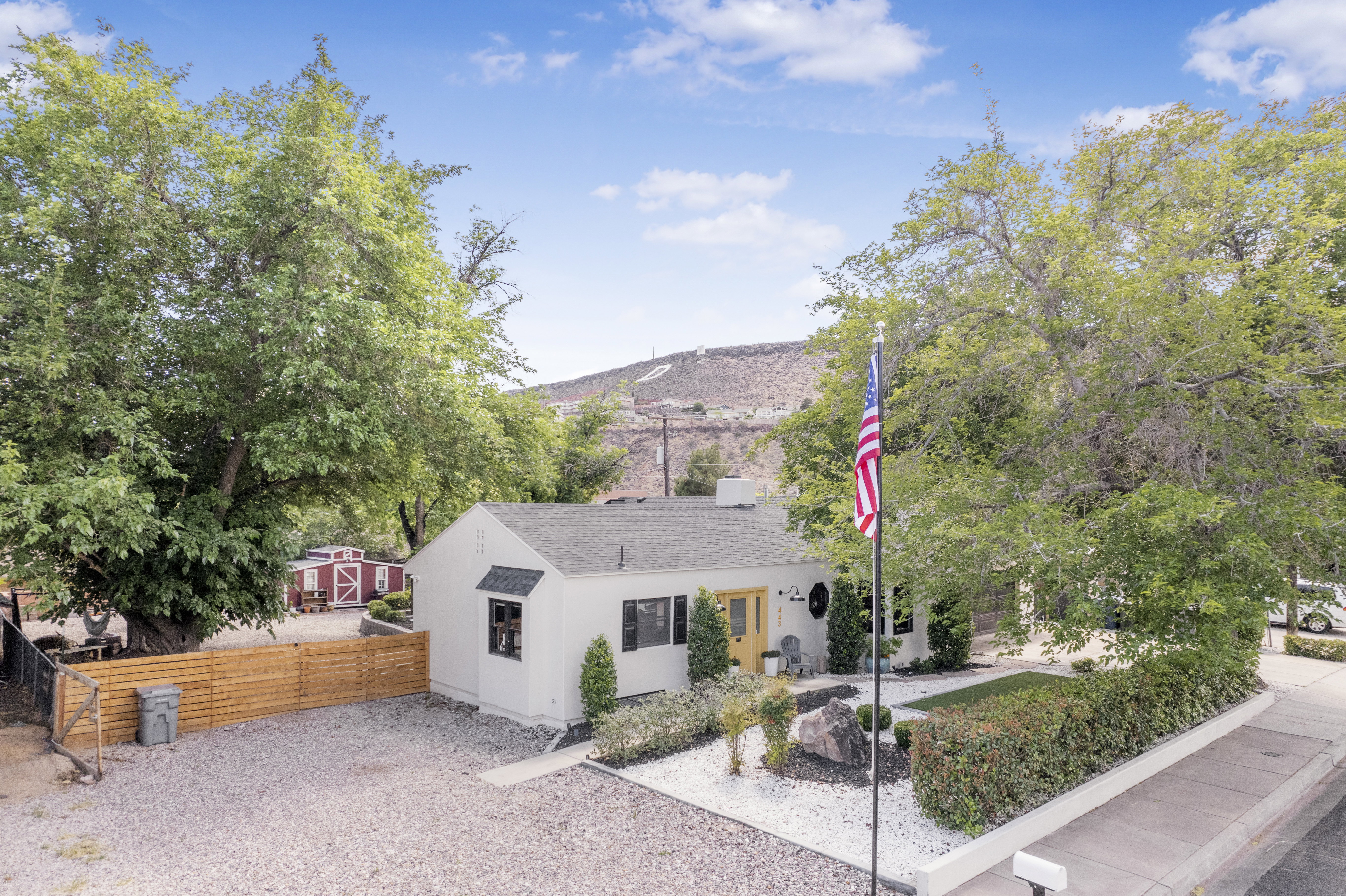 View of front of house with roof with shingles and a mountain view