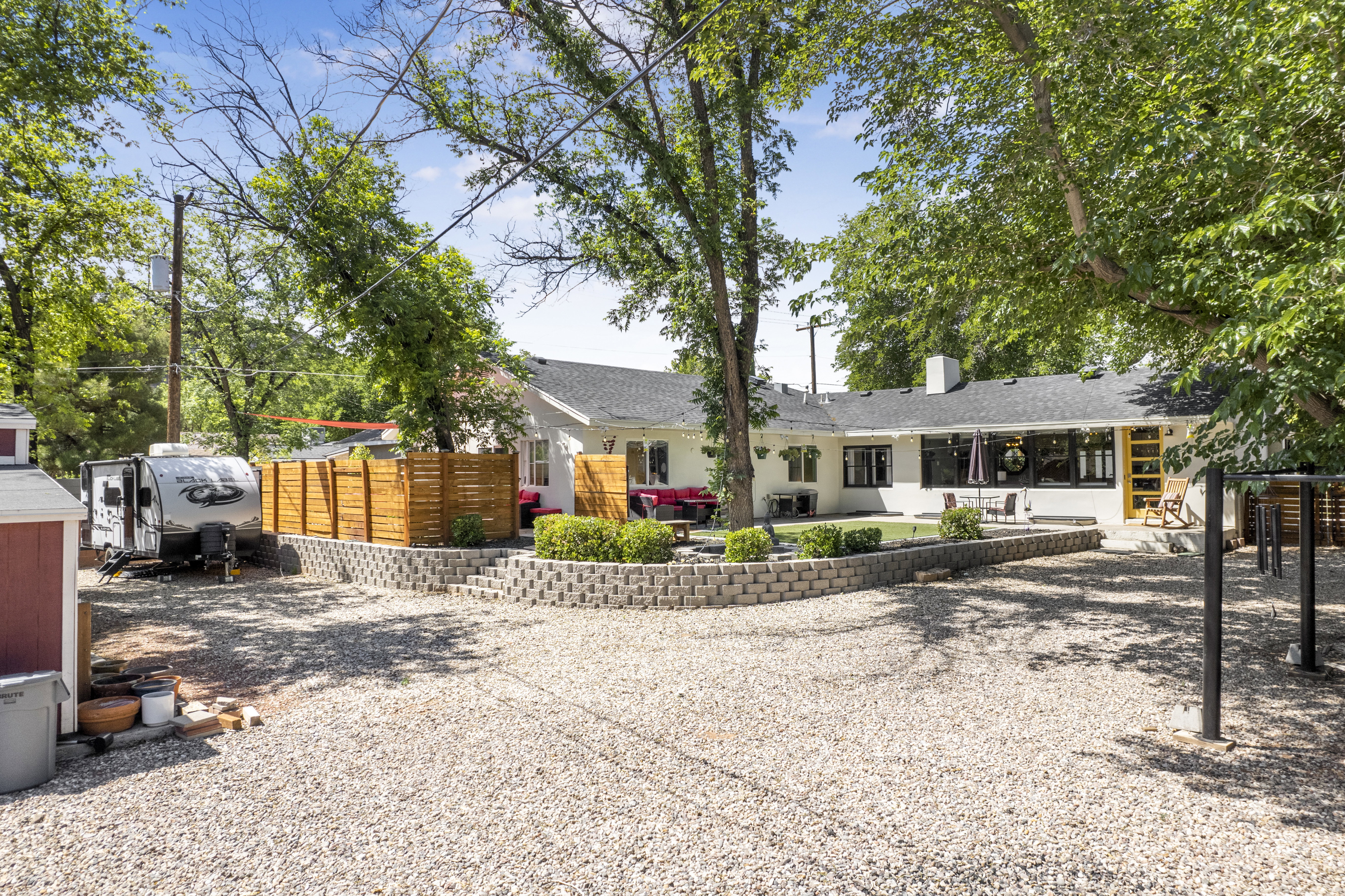 Ranch-style home with a patio area and a chimney