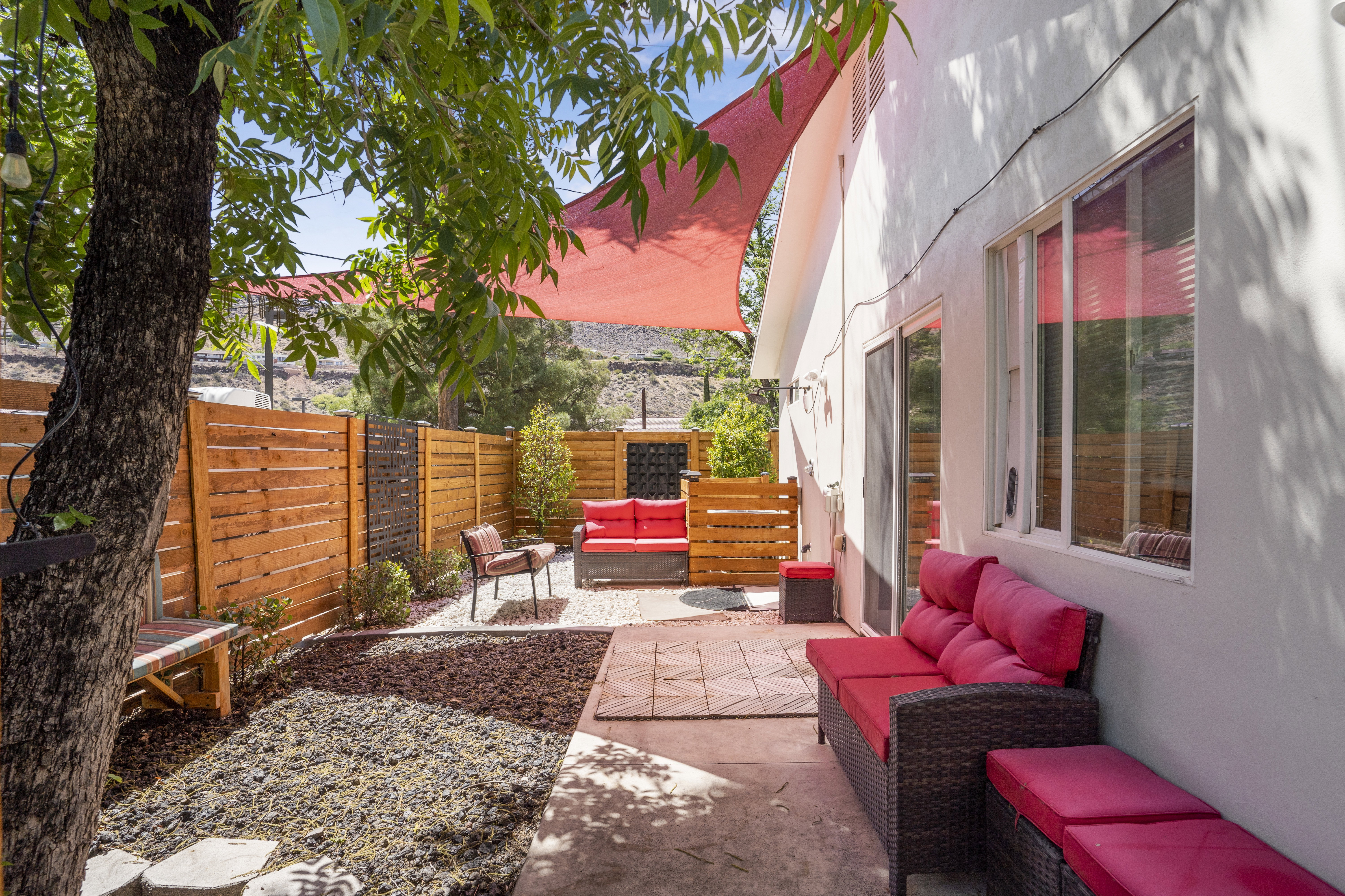 Fenced backyard featuring outdoor lounge area and a patio