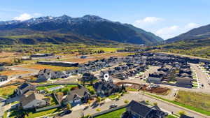 Aerial view of residential area featuring a mountainous background