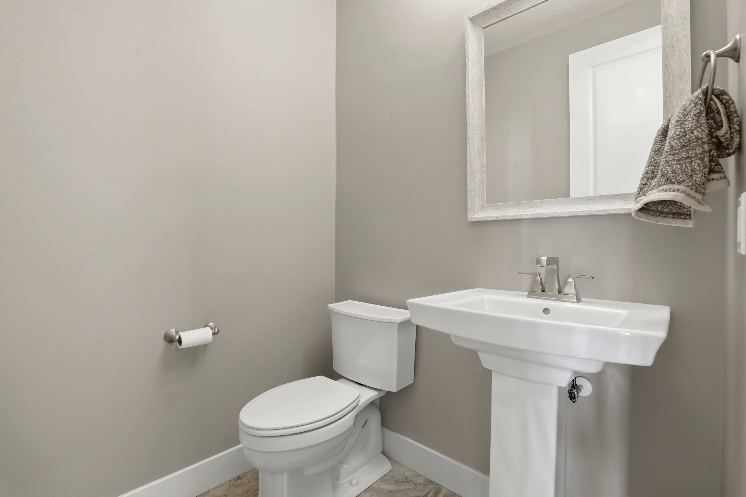 Bathroom with toilet and baseboards