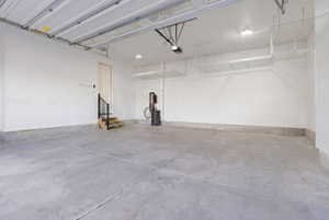 Garage featuring baseboards