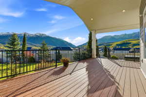 Wooden deck featuring a mountain view
