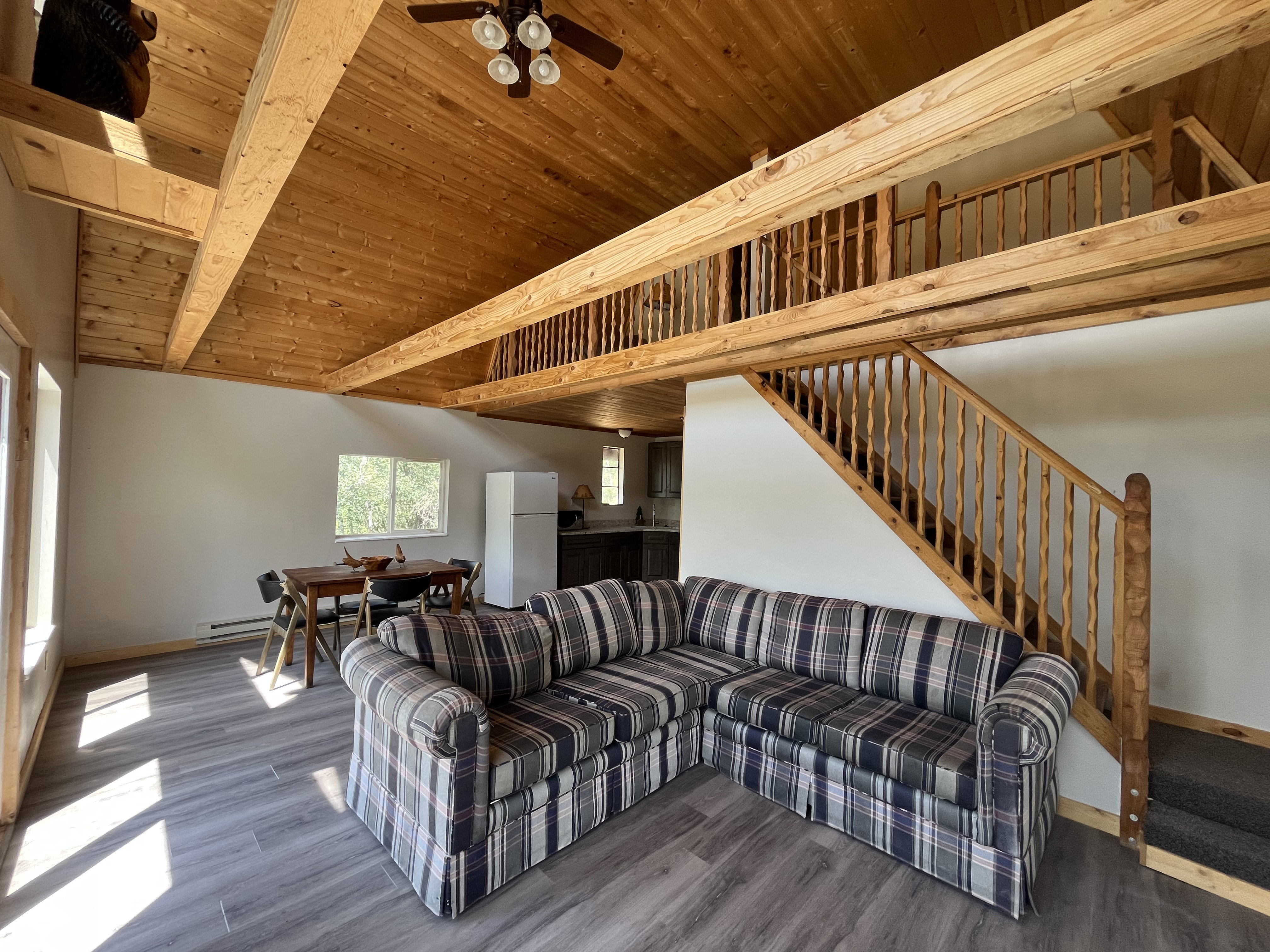Great room with vaulted ceilings and tons of windows.