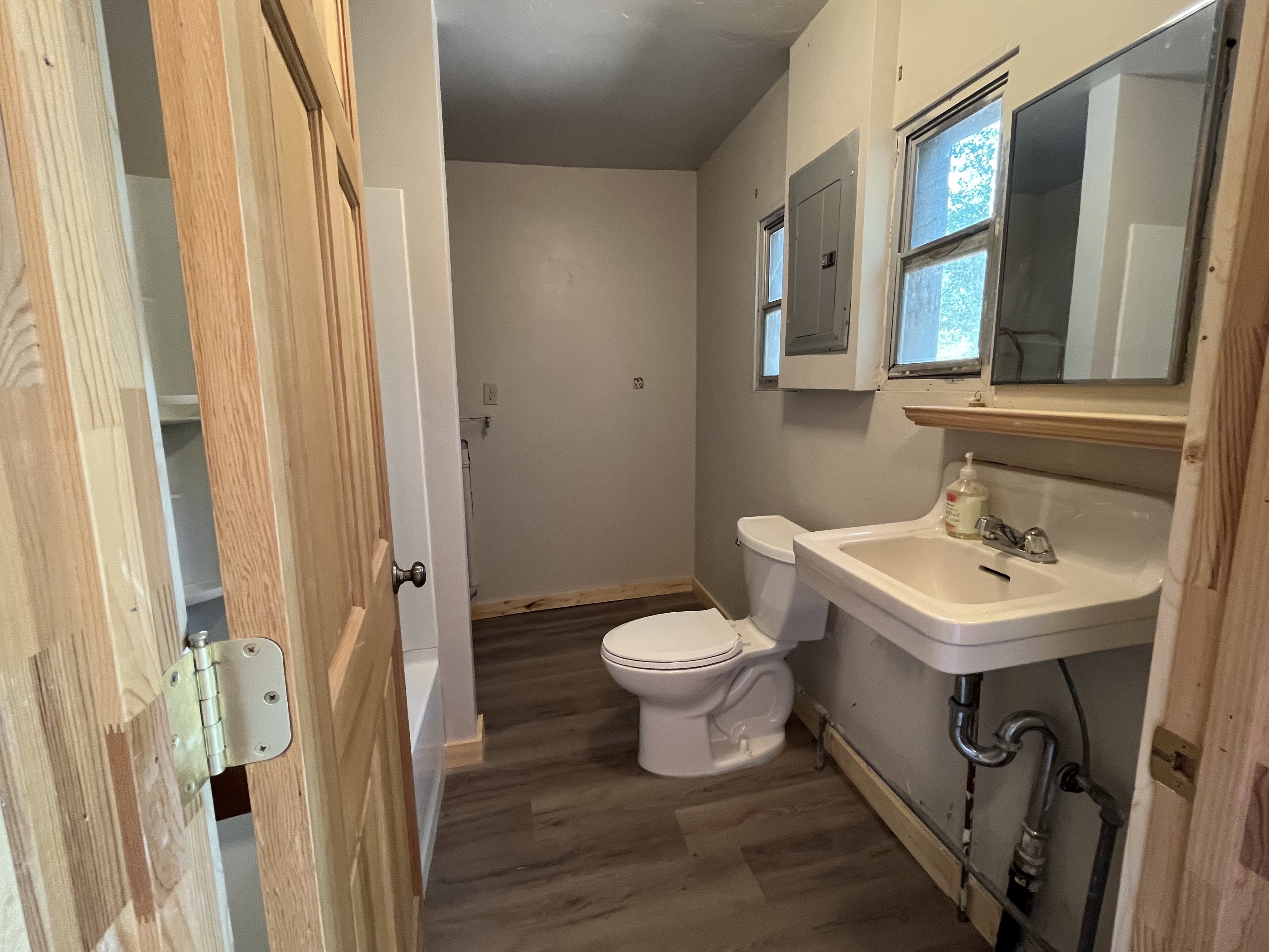 Bathroom with washer and dryer hookups.