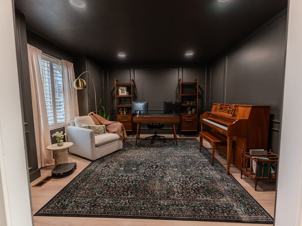 Office area featuring a decorative wall and recessed lighting