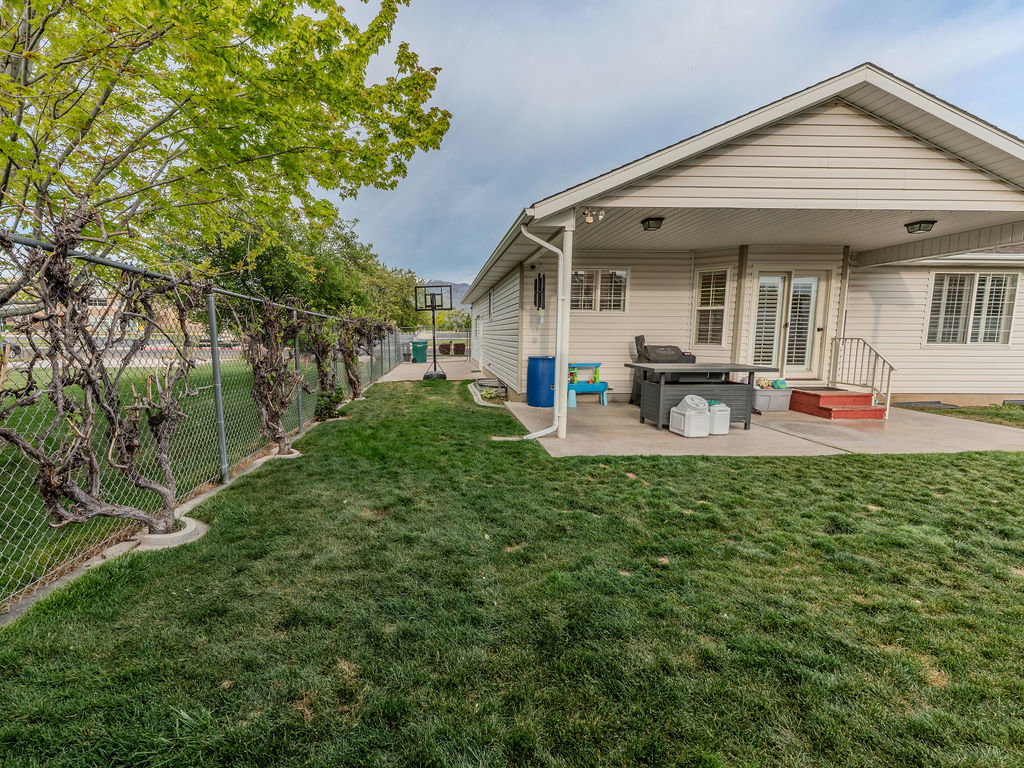 Rear view of house featuring a patio