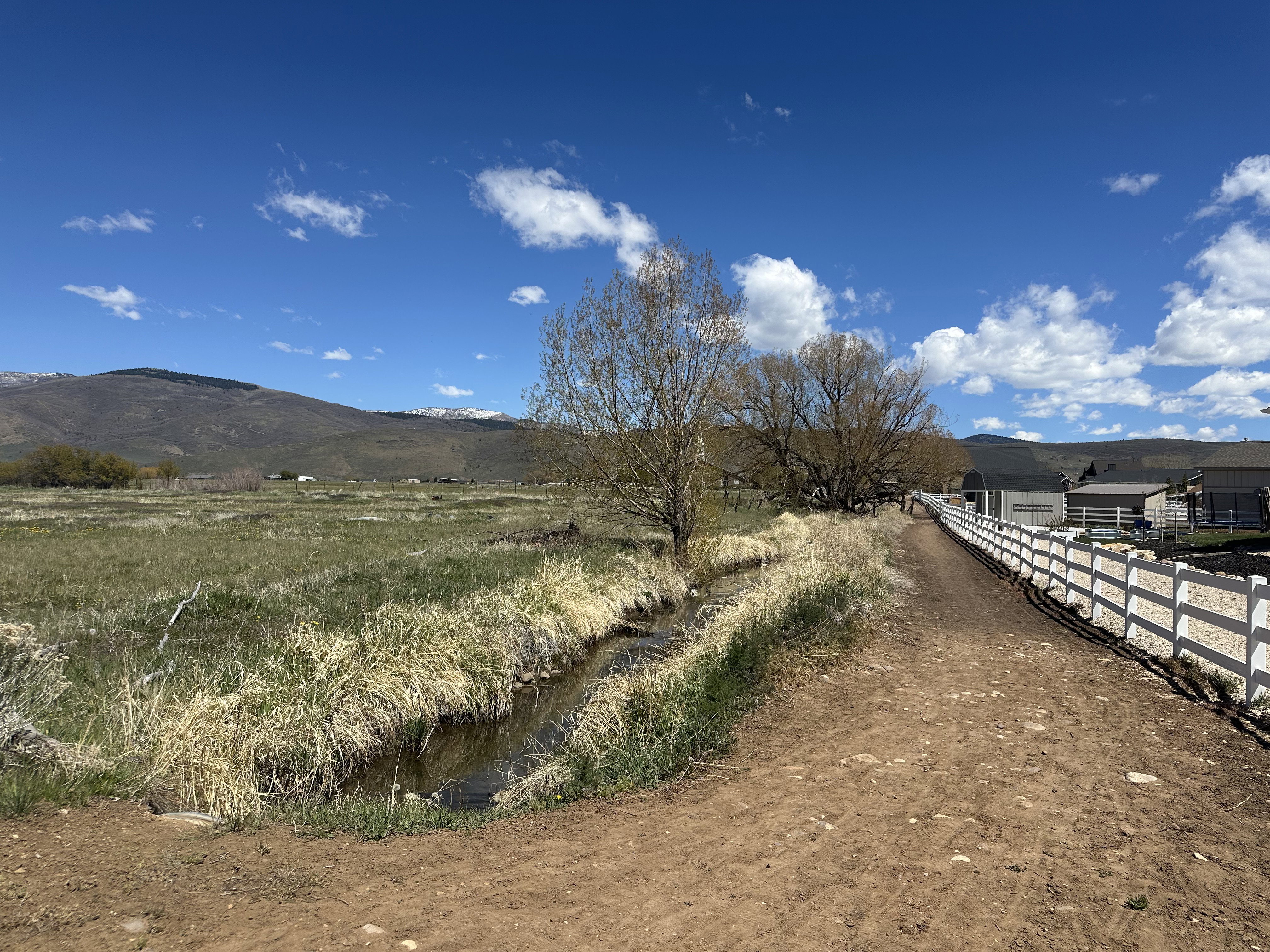 View of mountain backdrop featuring rural landscape