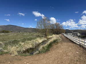 View of mountain backdrop featuring rural landscape