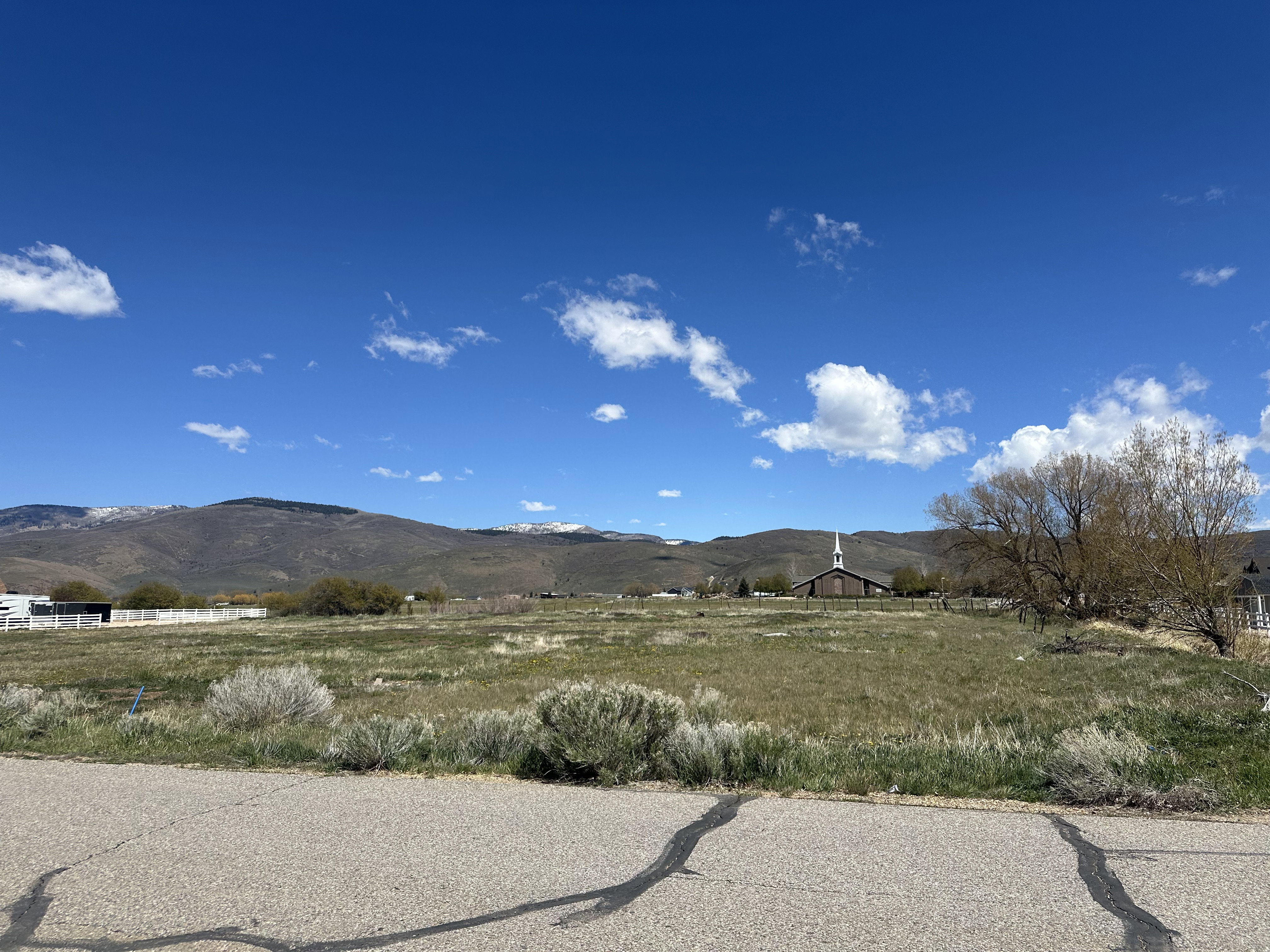 View of mountain background featuring rural landscape