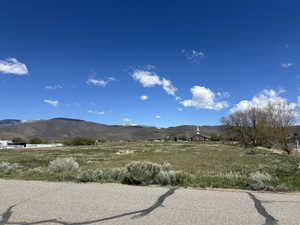 View of mountain background featuring rural landscape