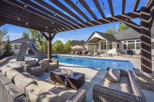 Fully fenced resort style back yard with timber pergola and salt water pool, truly and entertainers dream