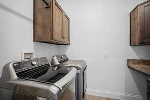 Main floor laundry room with lots of storage and counter for folding