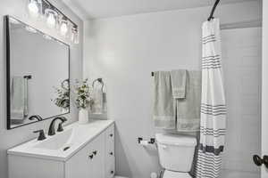 Lower level full bath with tub/shower combo and a  large vanity