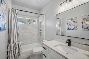Lower level full bath with tub/shower combo and a  large vanity