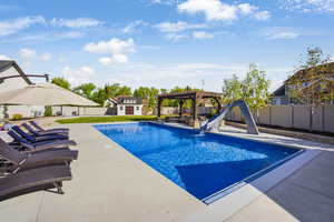 20 x 45 salt water pool, 4 ft tanning ledge, waterslide and automatic cover