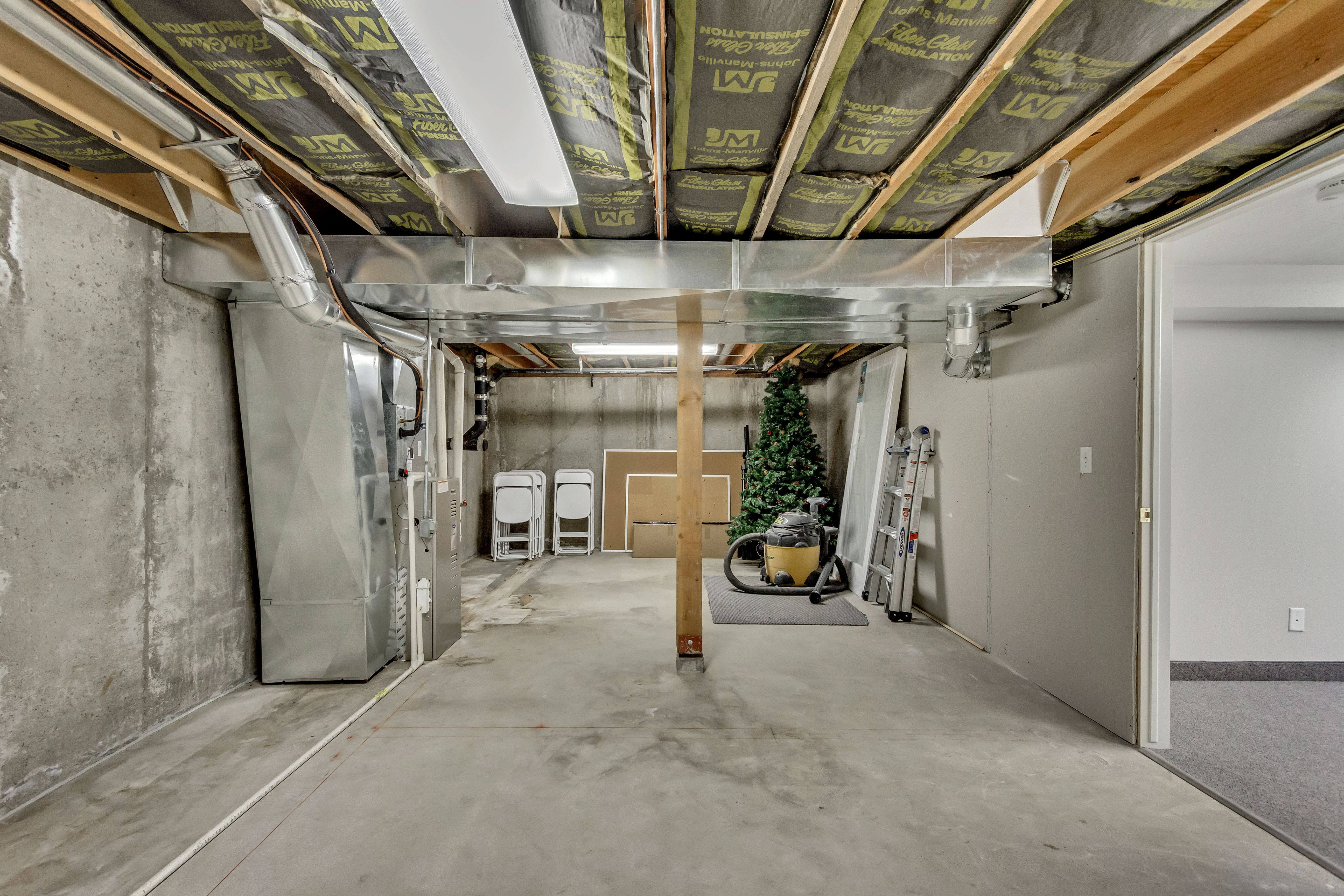 Unfinished below grade area with heating unit