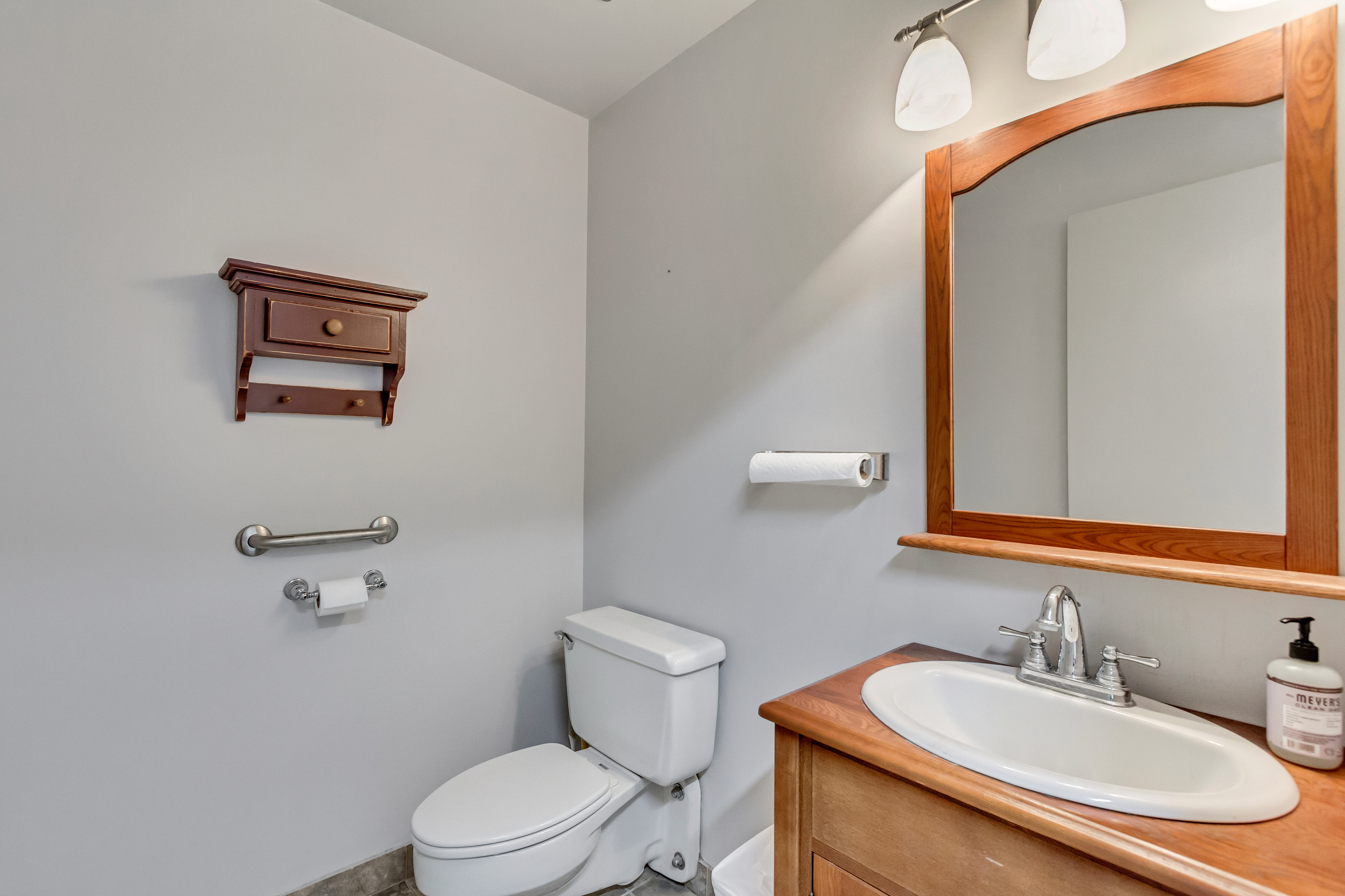 Half bath featuring vanity and toilet