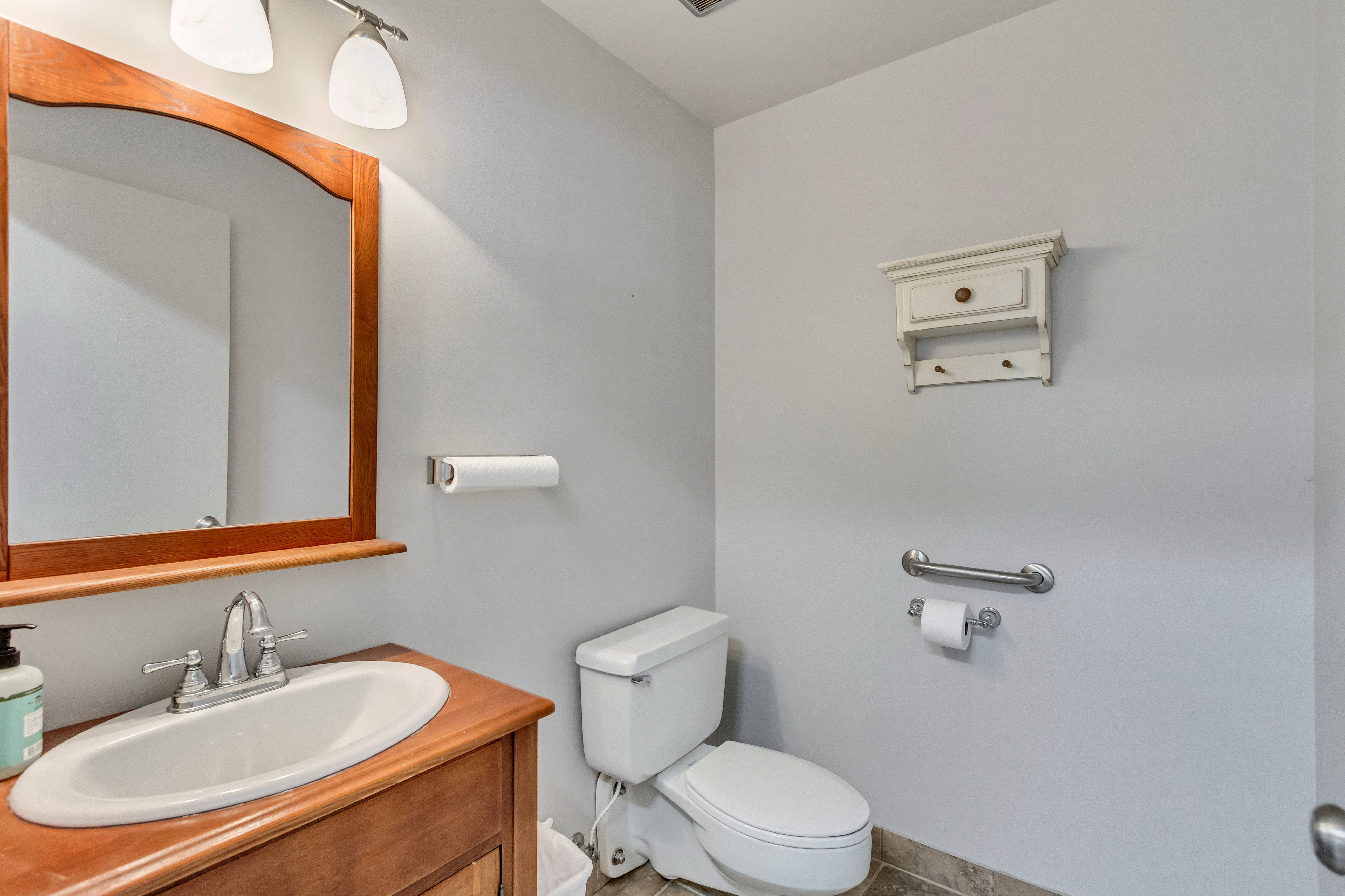 Half bath featuring vanity and toilet