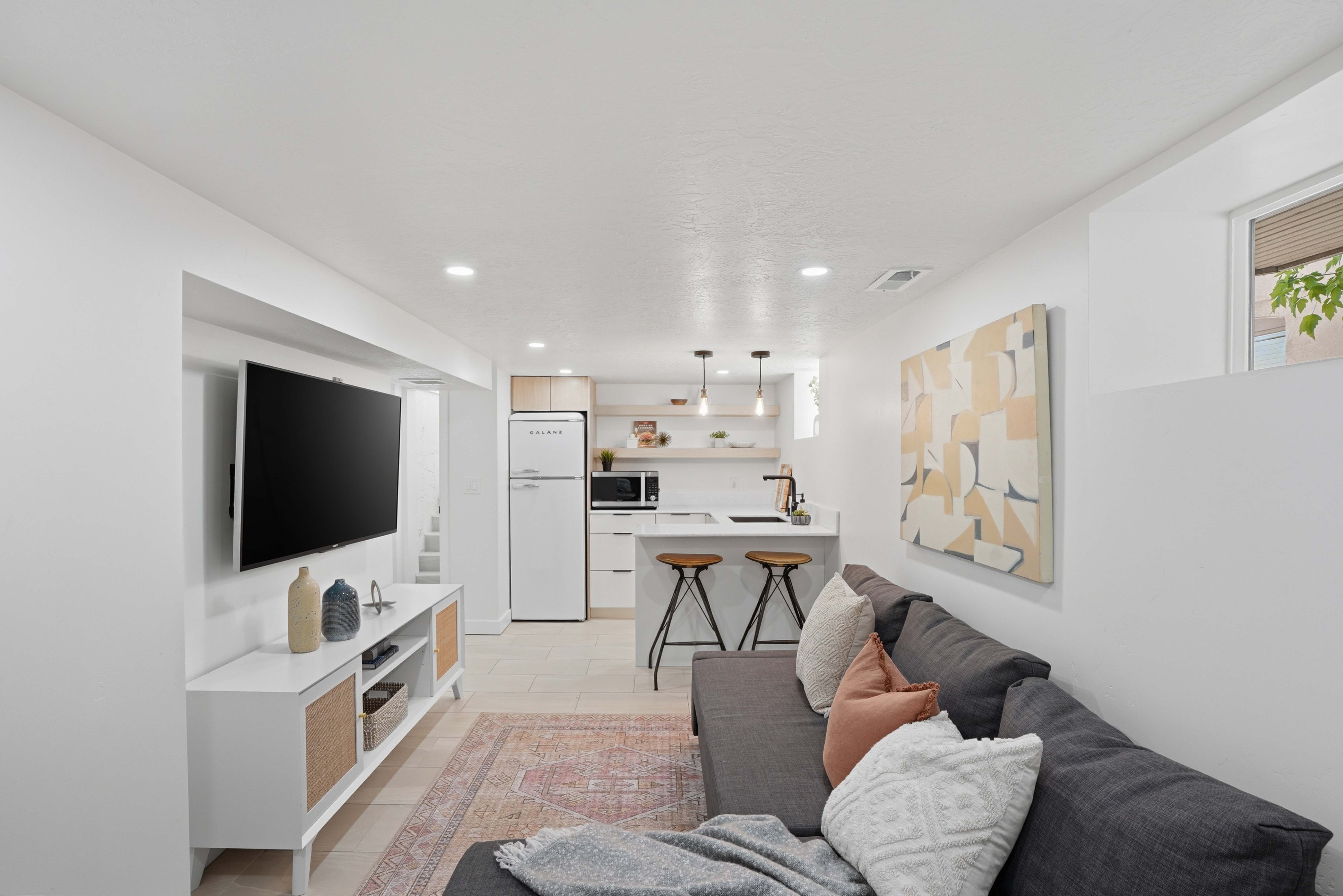 Private Lower Level Apartment Living area featuring recessed lighting and light tile flooring