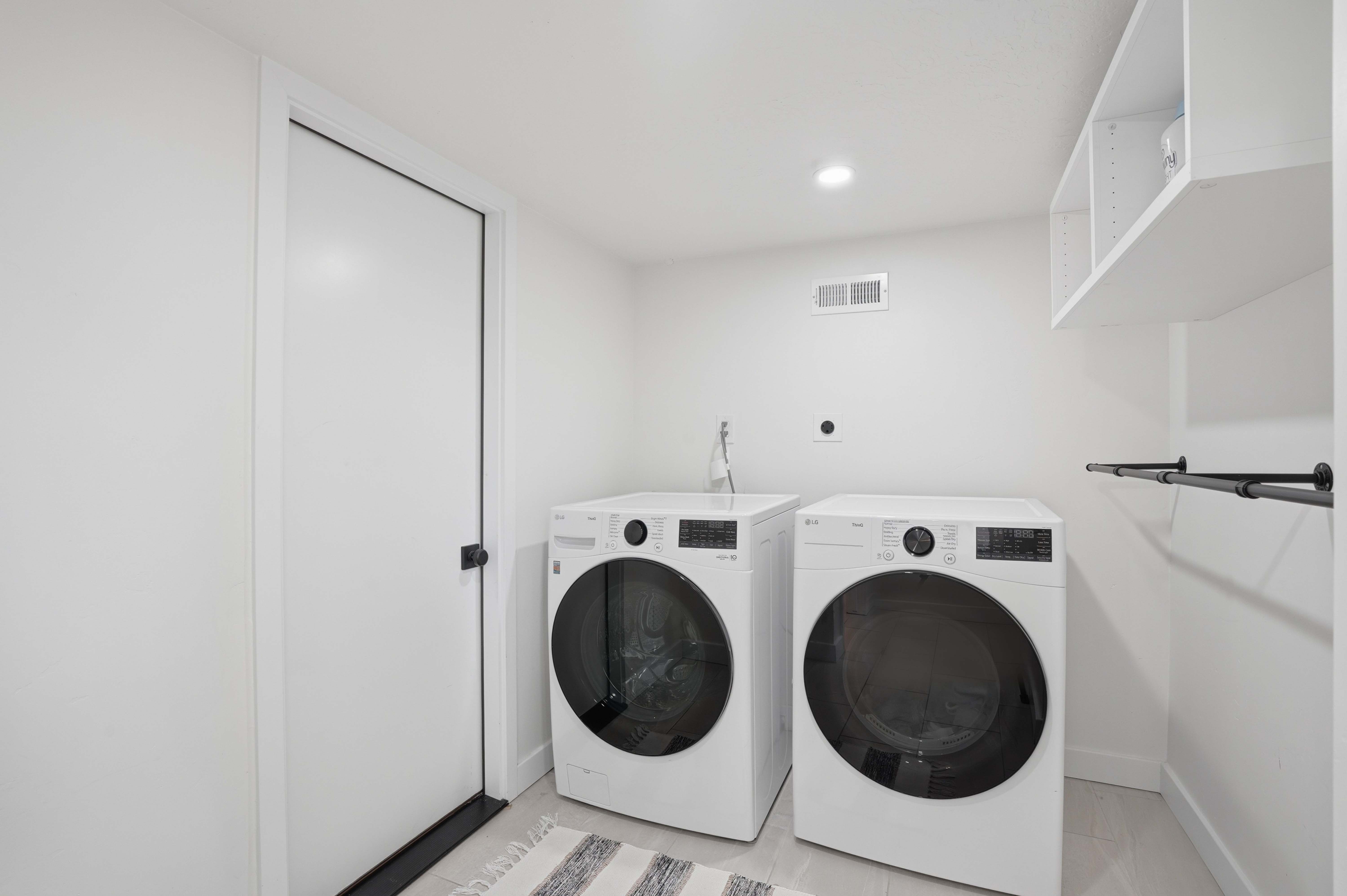 Laundry room featuring washing machine and clothes dryer and recessed lighting