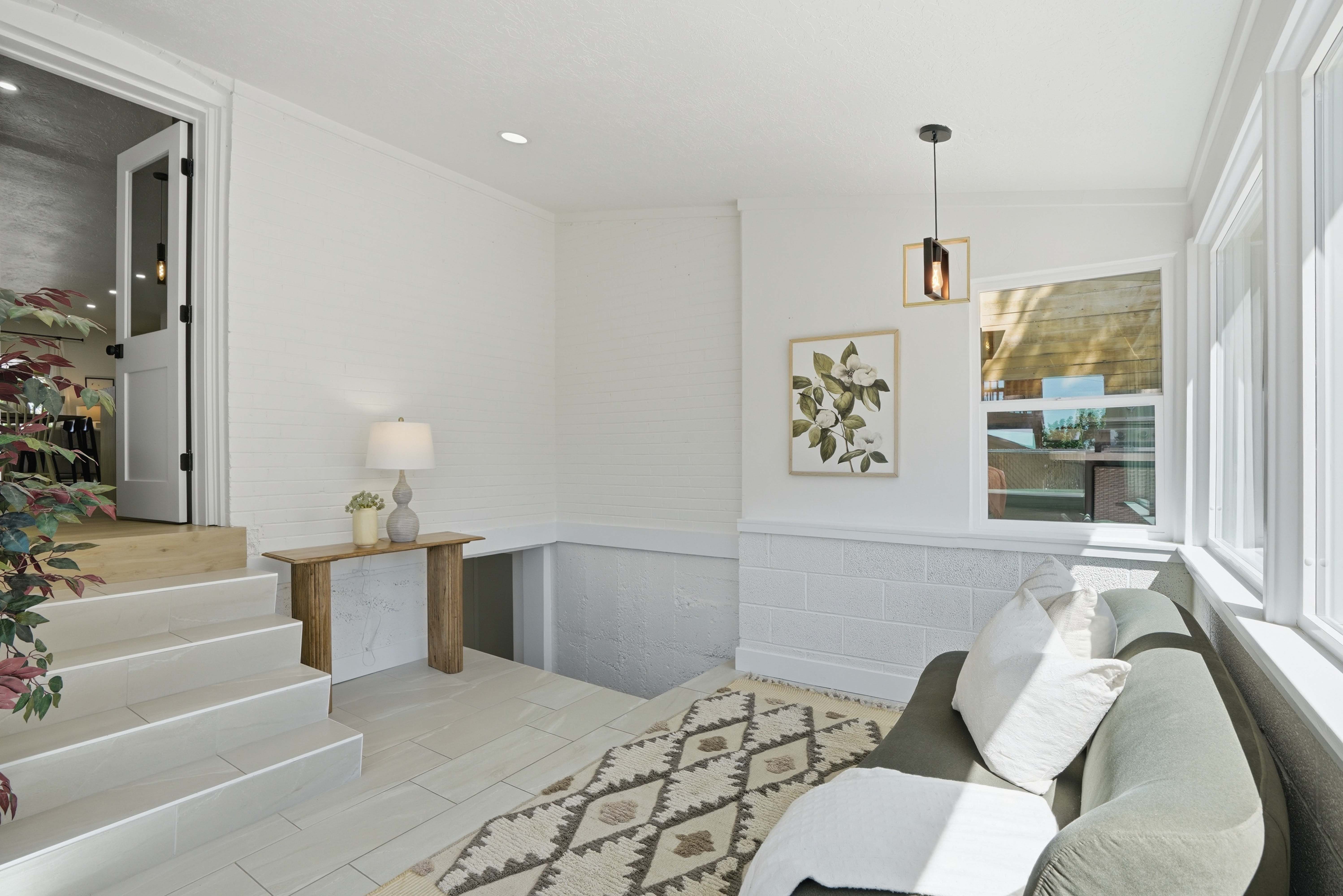 Sun room featuring a wainscoted wall and recessed lighting