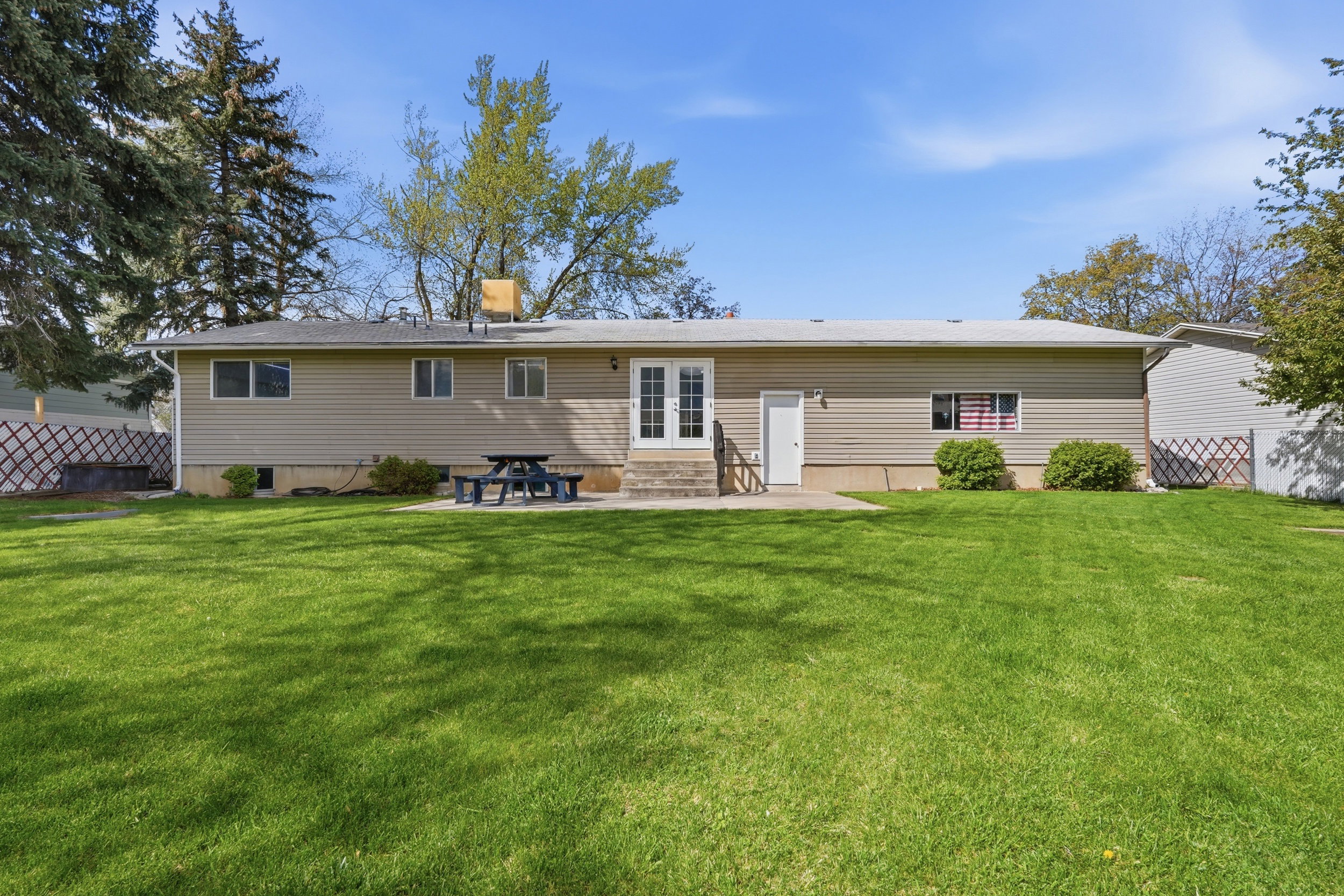 Back of property featuring a patio area, french doors, and entry steps
