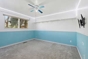 Unfurnished room with carpet flooring and ceiling fan