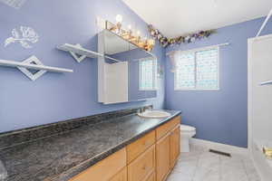 Bathroom with vanity, bathtub / shower combination, and light marble finish floors