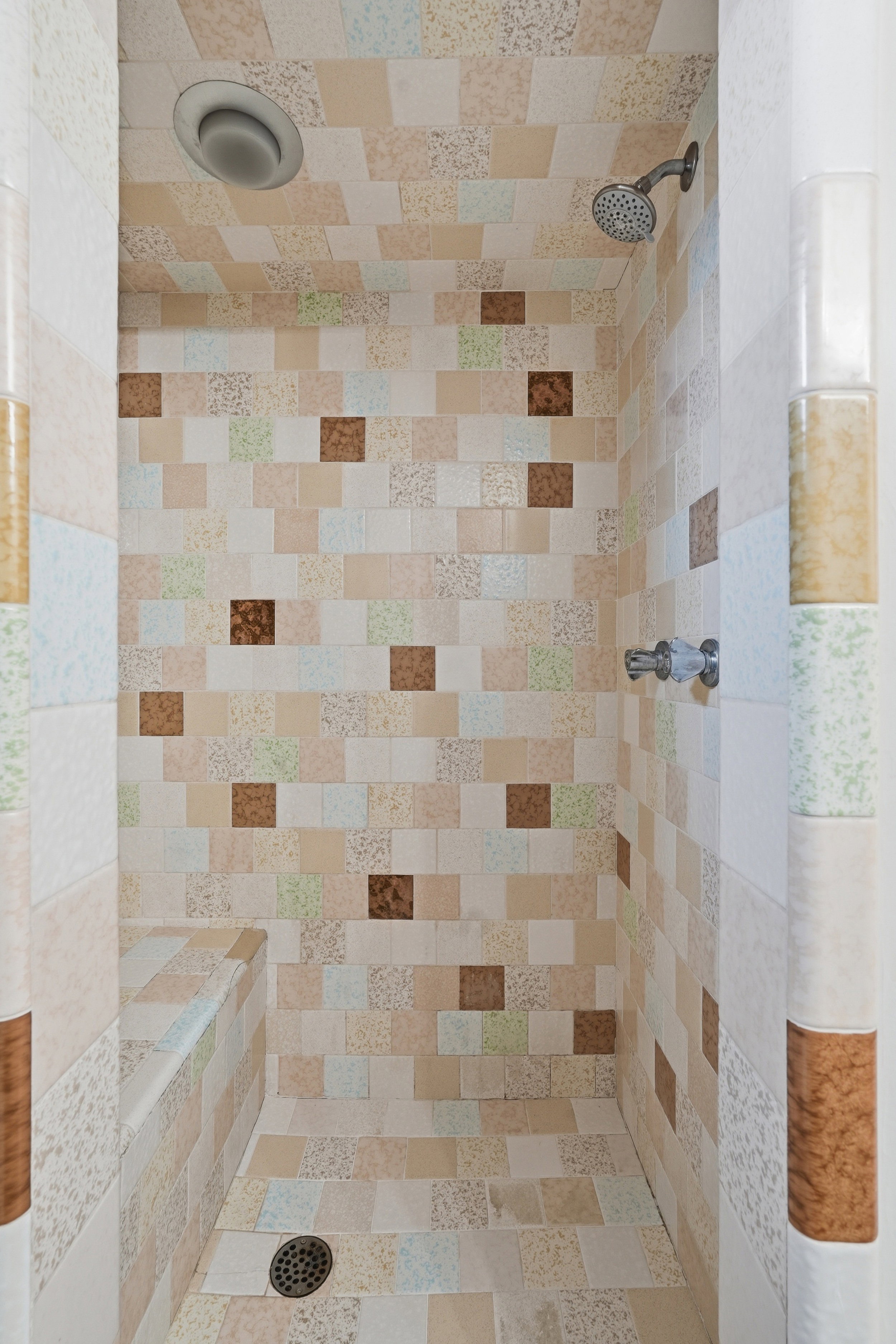 Full bathroom featuring tiled shower