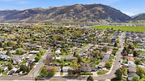 Aerial perspective of suburban area with a mountainous background