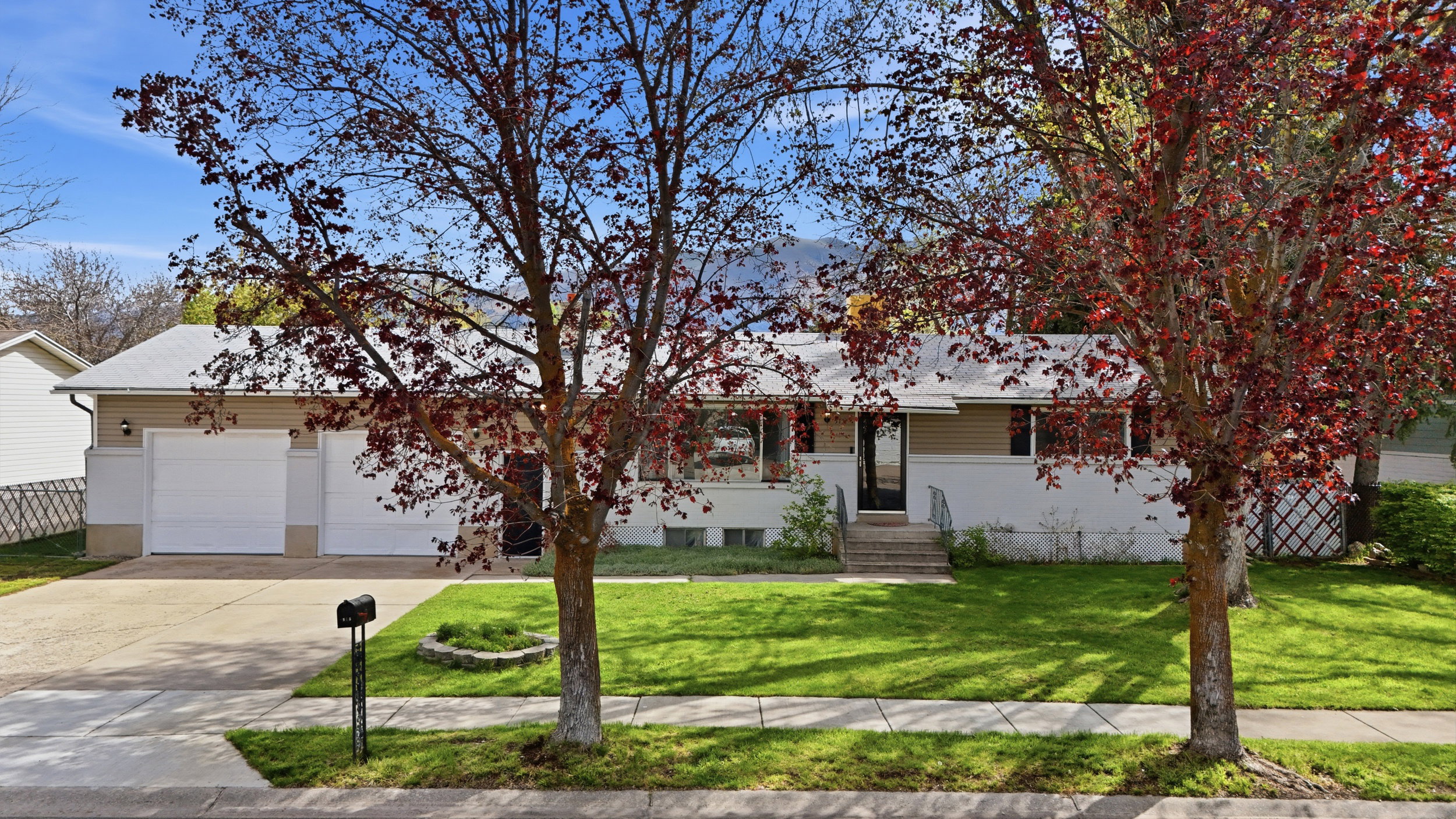 View of front of house with driveway and a garage