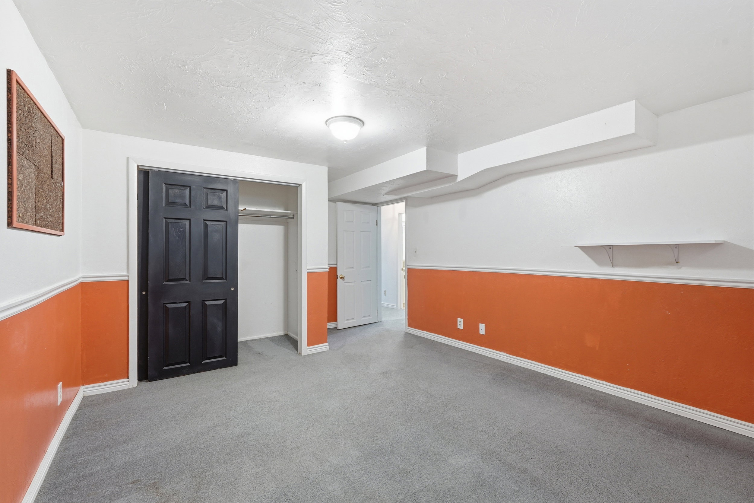 Finished below grade area featuring carpet and a textured ceiling