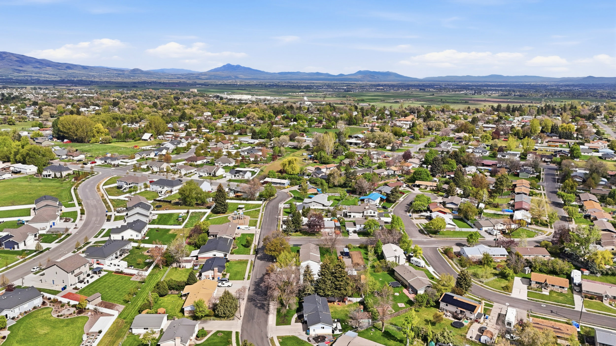 Aerial perspective of suburban area featuring mountains