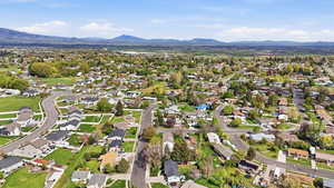 Aerial perspective of suburban area featuring mountains