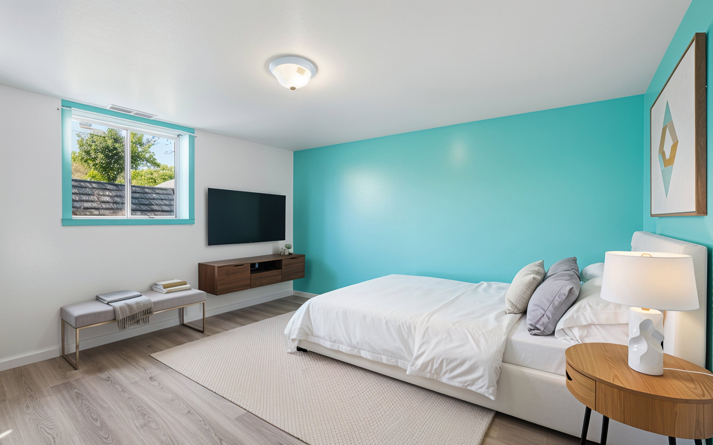Bedroom featuring wood finished floors and baseboards
