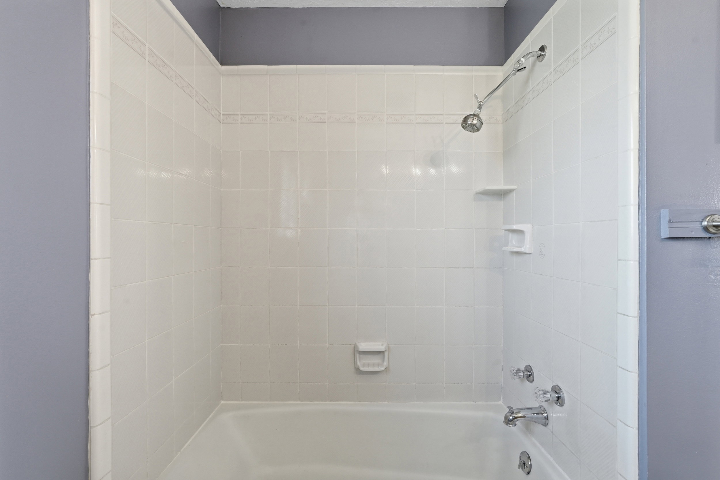 Bathroom with bathing tub / shower combination