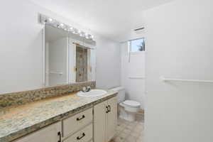 Bathroom with vanity and toilet