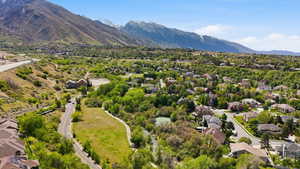 Aerial perspective of suburban area featuring a mountain backdrop