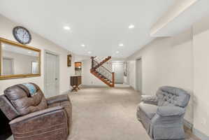 Spacious lower level featuring recessed lighting and neutral carpet flooring