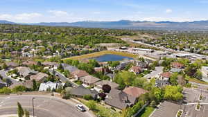 Aerial perspective of suburban area with a water and mountain view