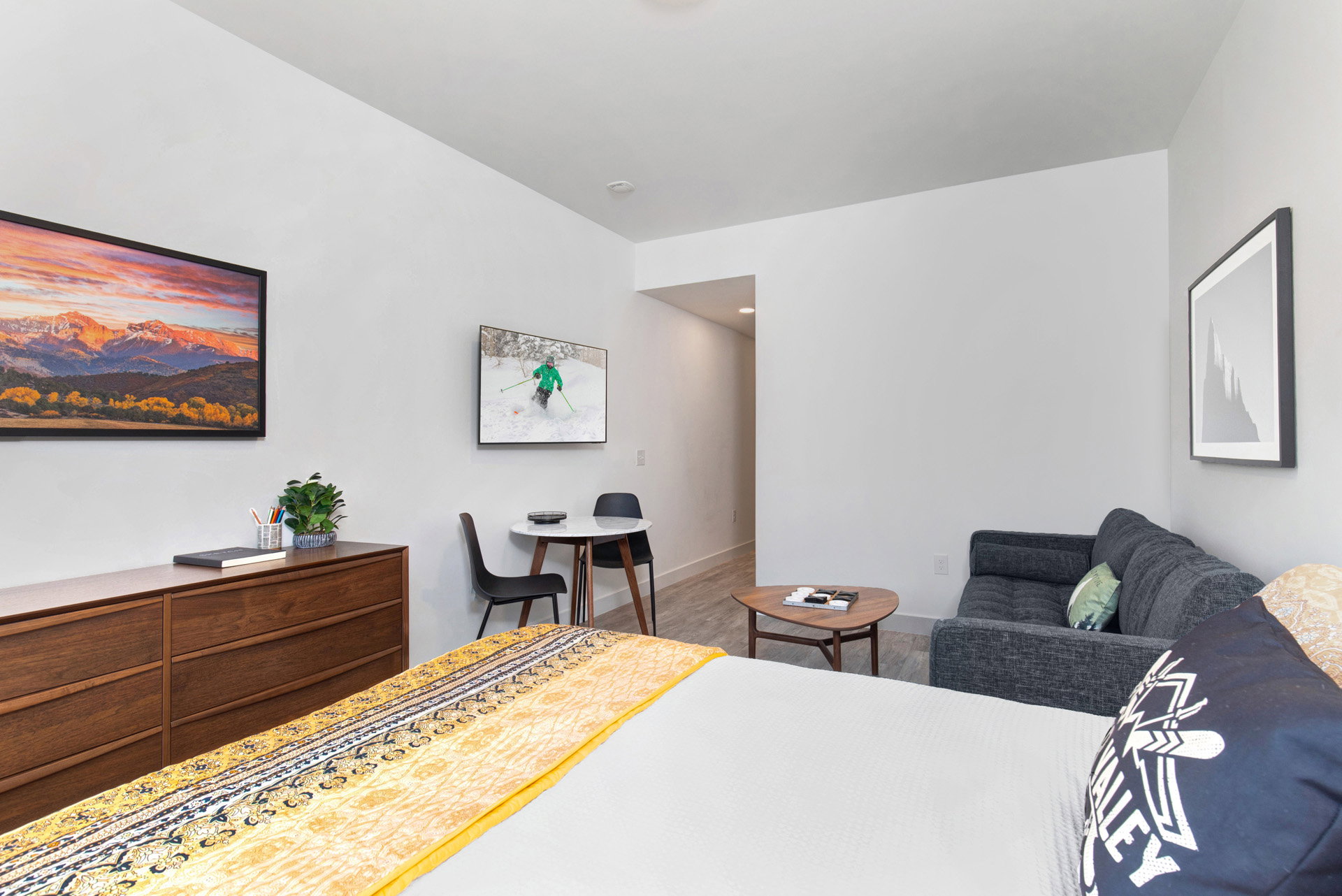 Bedroom with wood finished floors and baseboards