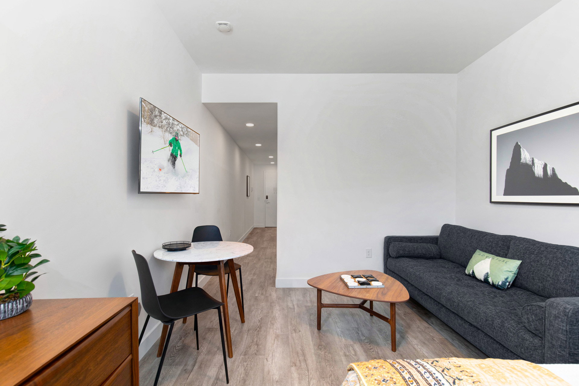Living room featuring light wood-style floors and baseboards