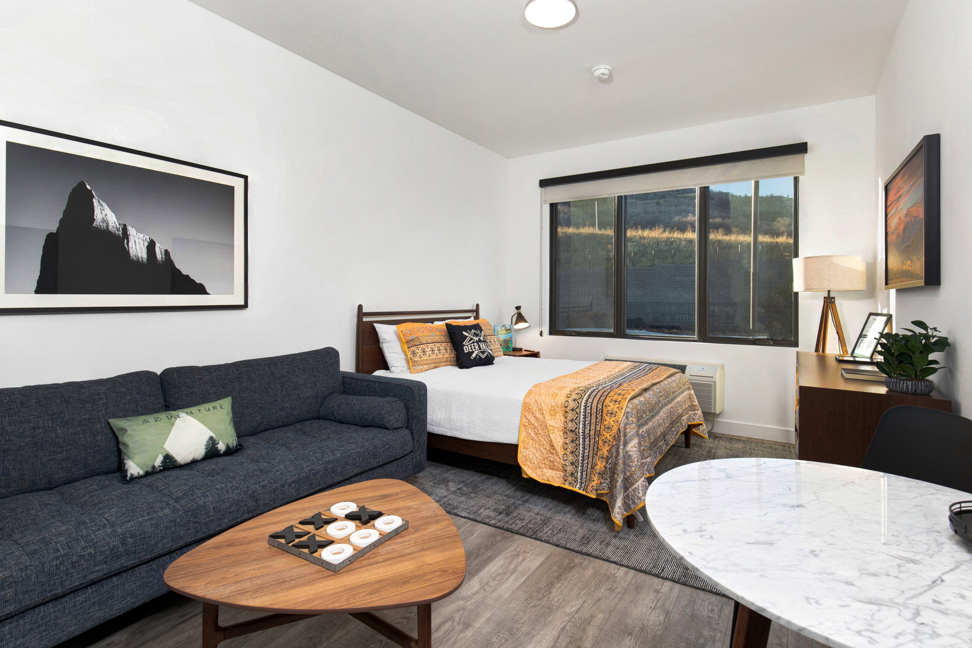 Bedroom featuring wood finished floors and baseboards