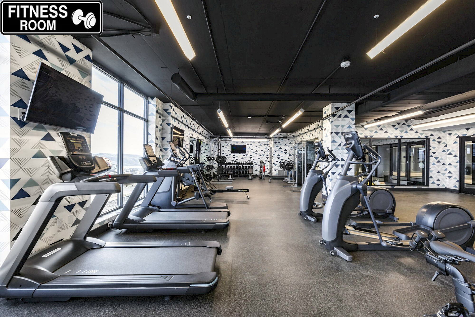 Workout area featuring wallpapered walls