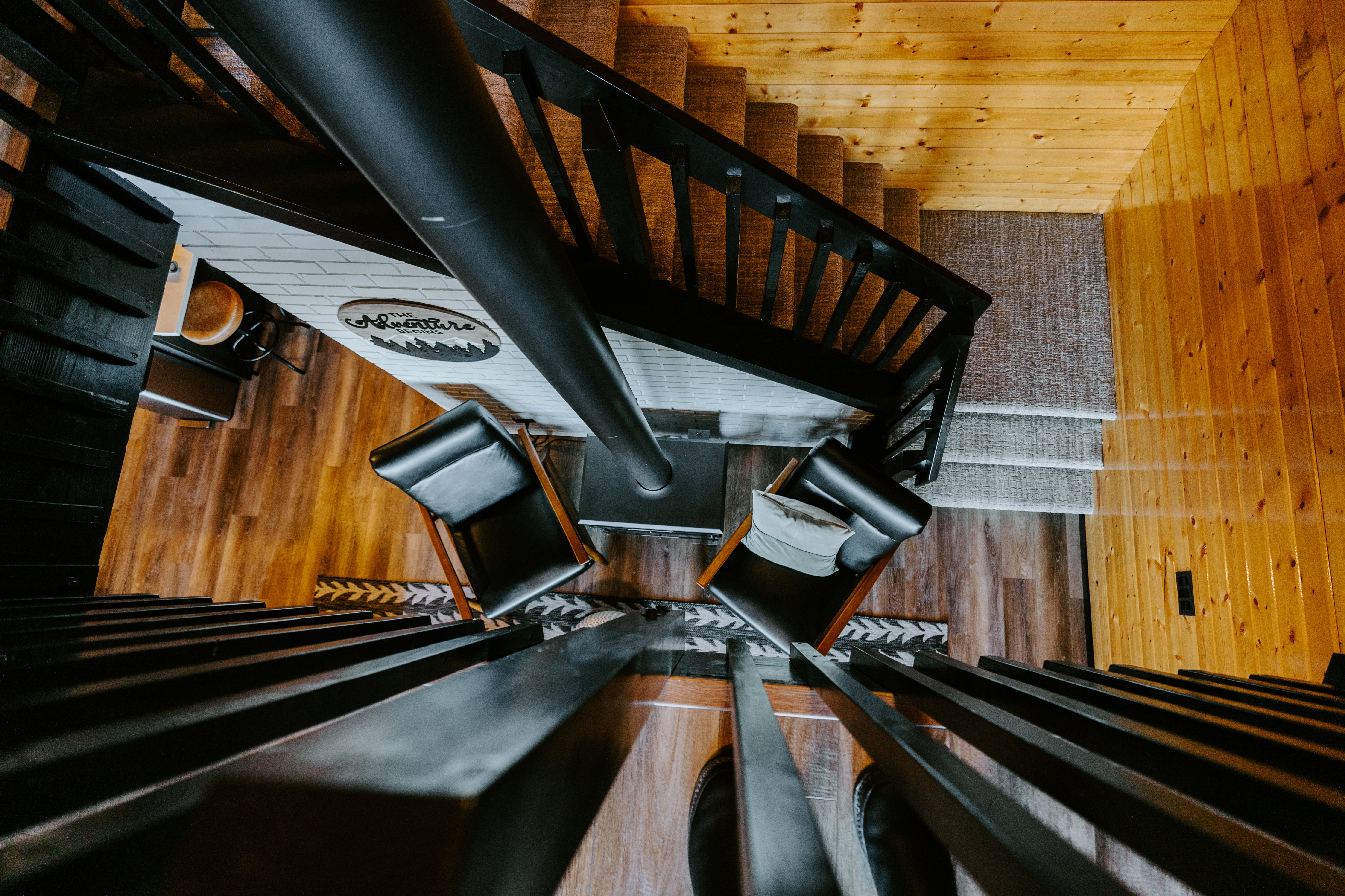 Stairway featuring wood walls and wood ceiling