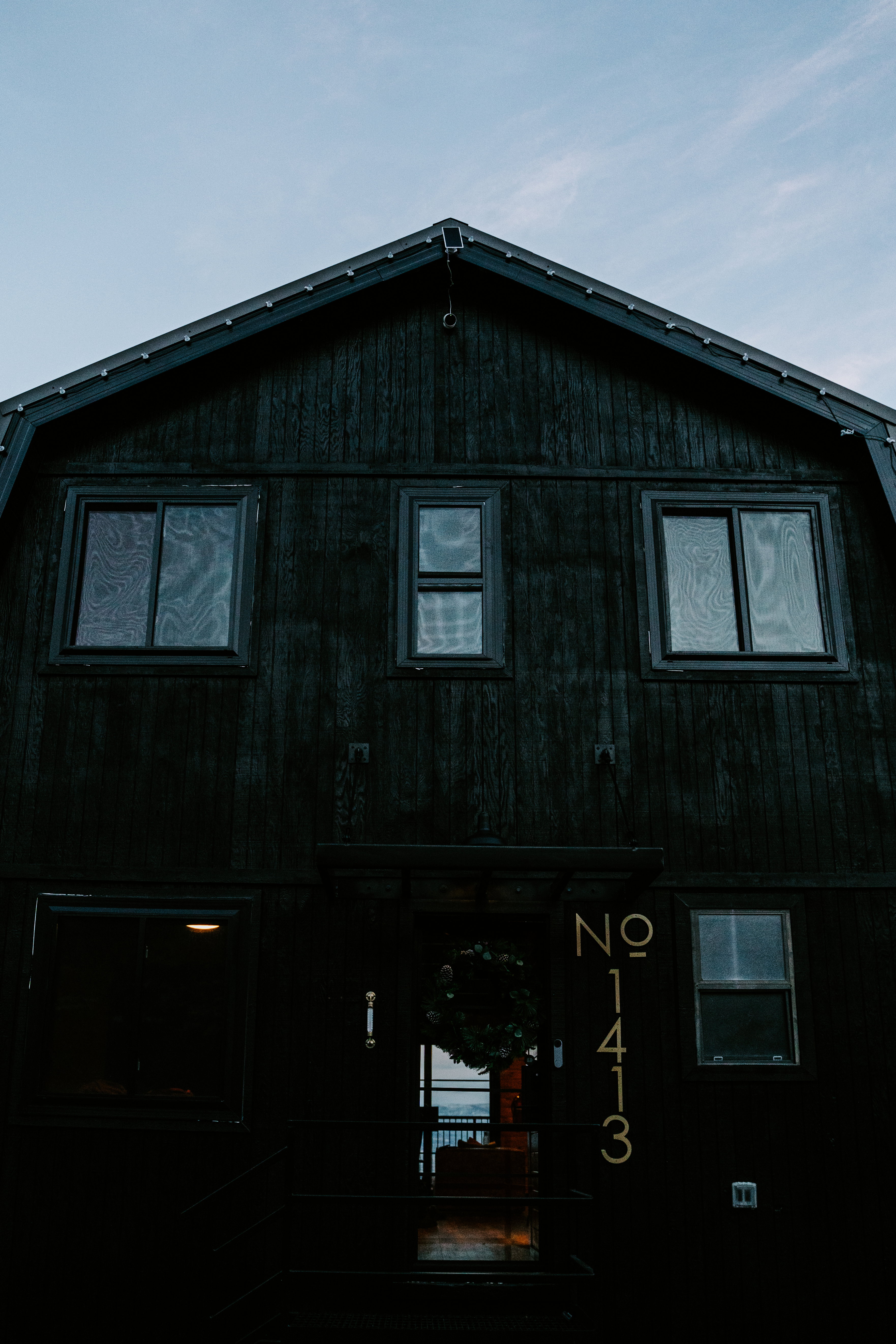 View of side of property featuring a porch